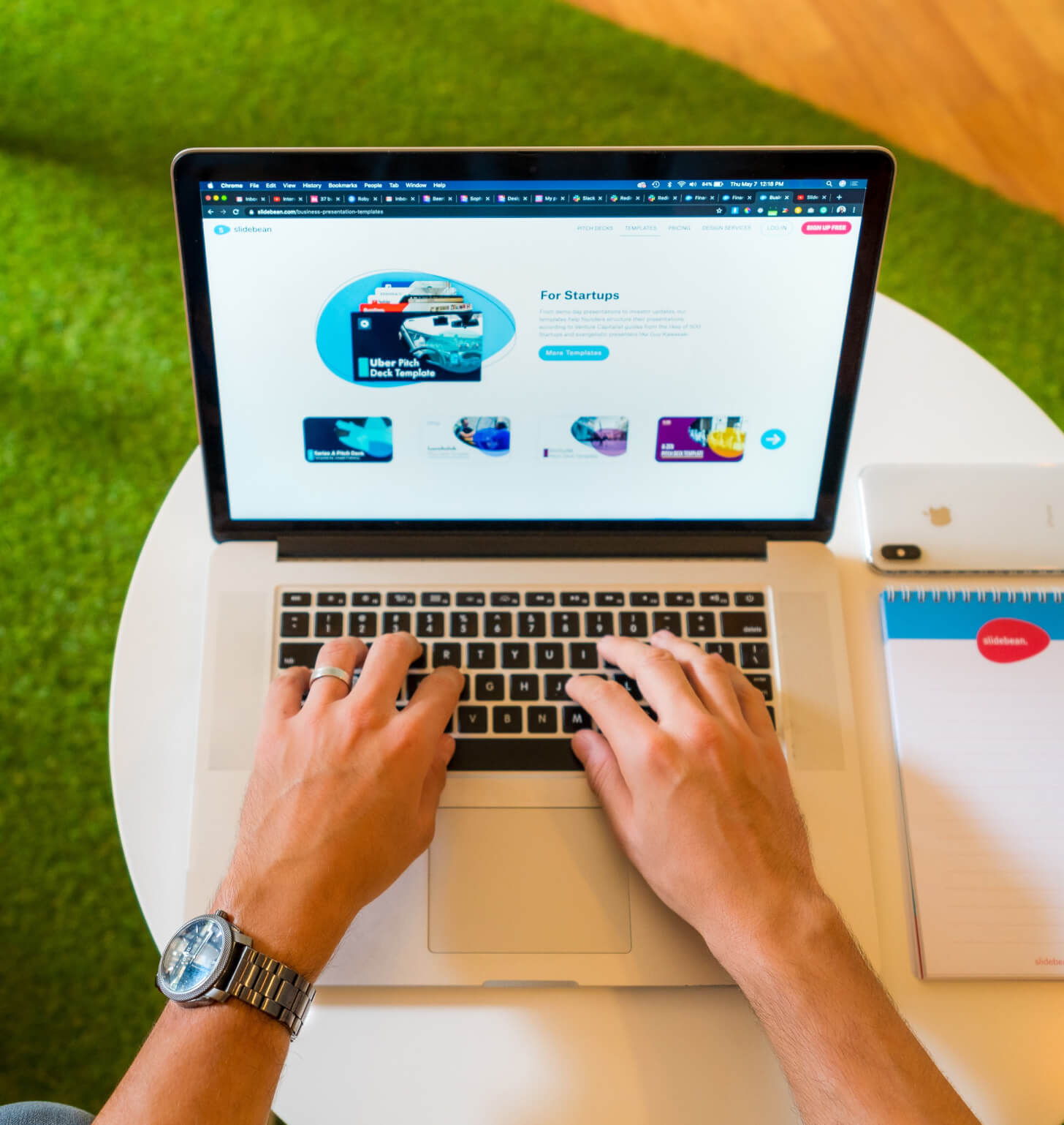 A Deltacron team member typing on a laptop